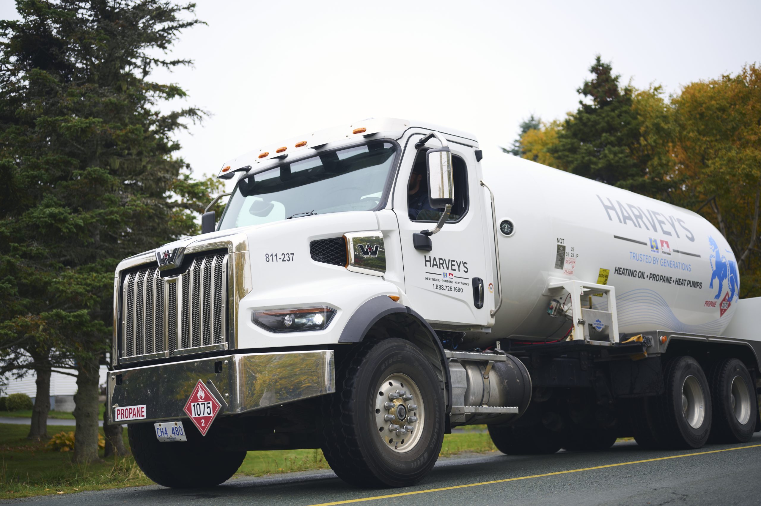 A Harvey's heating oil truck parked in a residential neighbourhood.
