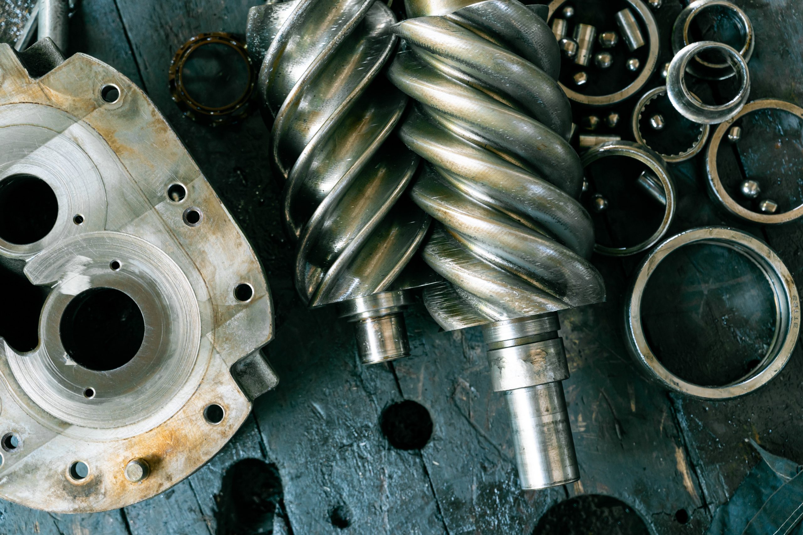 Closeup of a dismantled bearing and screw compressor.